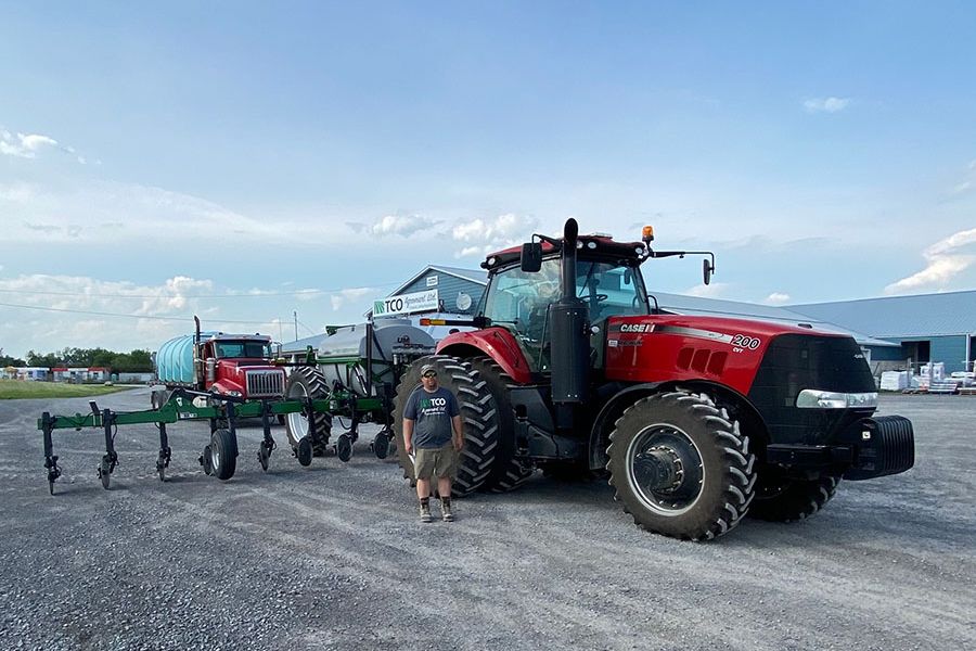 TCO Agromart Ltd. worker by farming machine